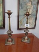 A pair of Victorian brass candlesticks