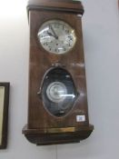 A wall clock with key and pendulum given to Constable John Lesley on his retirement from