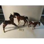 A Beswick horse and 2 foals