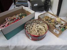 2 boxes of costume jewellery and a tin of pearl costume jewellery