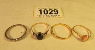 4 rings being a 22ct gold wedding band hall marked Birmingham 1937, A 9ct gold cameo ring,