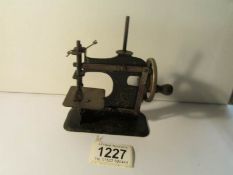 An early small miniature sewing machine, No.