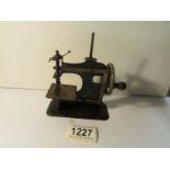 An early small miniature sewing machine, No.