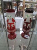 A pair of ruby glass vases