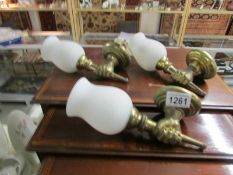 3 brass wall lights in the form of a fist complete with glass shades