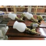 3 brass wall lights in the form of a fist complete with glass shades