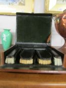 A gentleman's brush set in original leather case.
