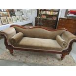 A mahogany framed double ended chaise longue.