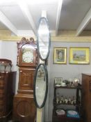 A pair of oriental style oval bevel edged mirrors, one a/f.