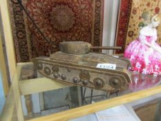 A carved wooden trinket box in the form of a tank