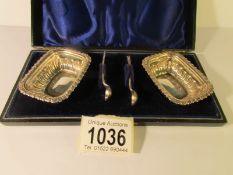 A cased pair of silver salts with spoons,