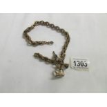 An ornate watch chain with 2 fobs and key