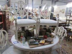A white painted dining table and 5 chairs including 2 carvers