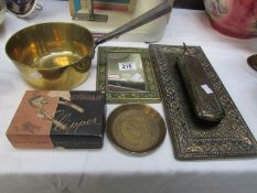 A brass saucepan, jubilee tray, brass framed mirror, brush set and clippers.