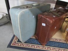2 old suitcases including Revelation
