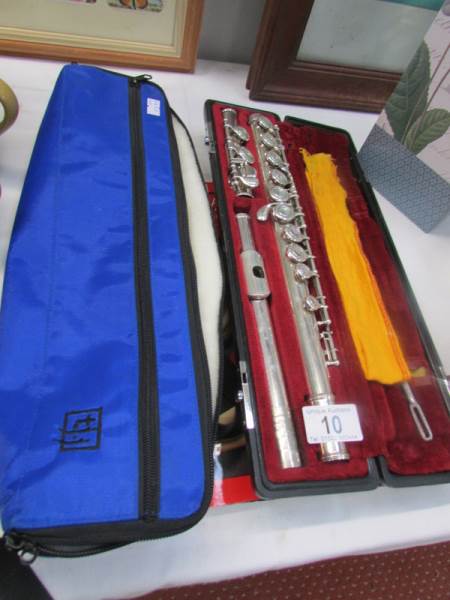 A cased Yamaha flute with sheet music