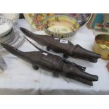 A pair of old African carved crocodiles and one other