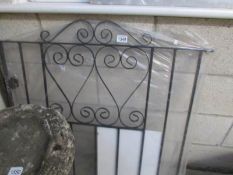 A new wrought iron gate.