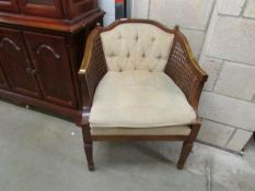 A mahogany framed bergere chair.