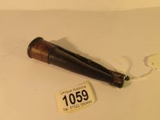 A small (5" long) 18th century horn and leather powder flask