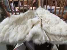 A vintage white fur cape