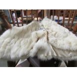 A vintage white fur cape