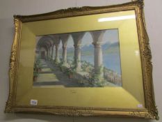 A framed and glazed watercolour 'The Cloisters' signed T.