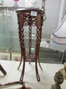 A mahogany plant stand