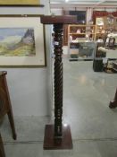 A mahogany barley twist plant stand.