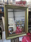 A gilt framed mirror