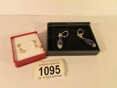 A pair of lapis lazuli pendant earrings and a pair of pearls set in 9ct gold pendant earrings