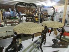 A pair of Victorian mahogany cabriole leg chairs.