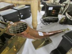 An hold copper horn on stand.