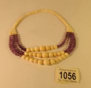 An ivory and purple beads necklace