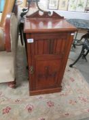 A mahogany pot cupboard.