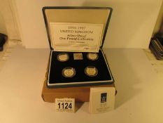 A cased Royal MInt silver proof £1 coins collection 1994-1997, 4 coins and plaque,