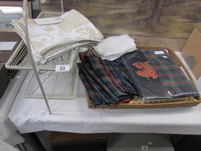 A quantity of table cloths etc