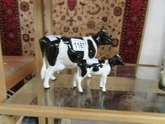 A Beswick cow and calf