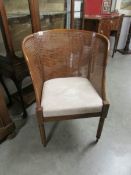 A mahogany framed bergere chair.