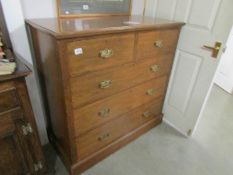 An oak 2 over 3 chest of drawers