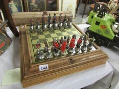 A Napoleonic style chess set (Chess pieces in cabinet)