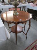 A mahogany pie crust edge table