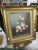 An oil on canvas still life signed S Laigh.