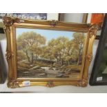 An oil on board entitled 'Autumn on the Artra' by T. Heathcote.