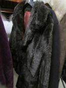 A ladies faux fur coat.