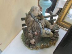 A Capodimonte tramp on a bench a/f