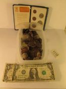 A mixed lot of coins and 2 USA one dollar bills
