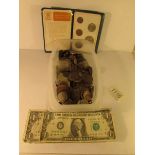 A mixed lot of coins and 2 USA one dollar bills