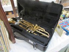 A cased 'Jazz' trumpet