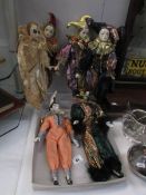 A collection of jester/harlequin dolls